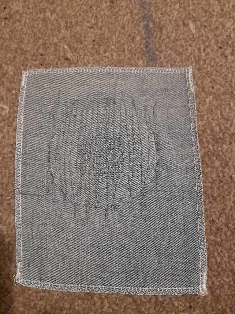 The back of the same sample. The denim and thread are a good match, so the mend is hard to see. This is the bit that would be inside your jeans