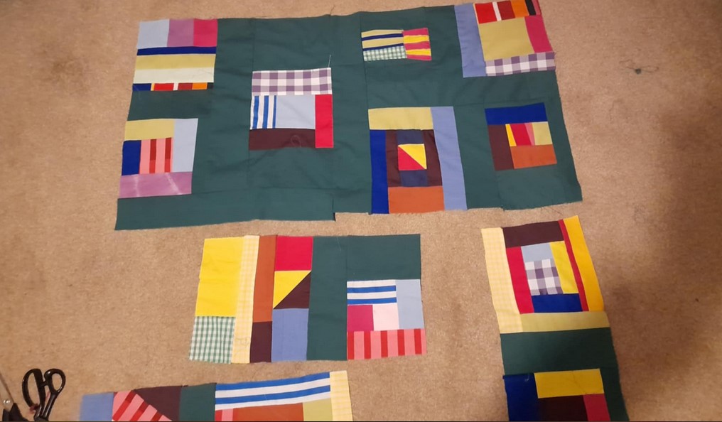 The patchwork blocks have even more green strips attached to them and they're starting to get sewn together into bigger blocks.